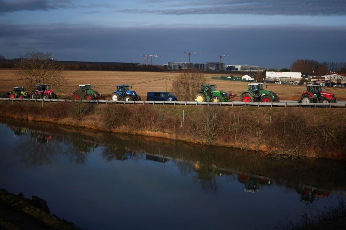 Tractors are lined up during a blockade by farmers on the A4 highway to protest over price pressures, taxes and green regulation, grievances that are shared by farmers across Europe, in Jossigny, near Paris, France, on January 31, 2024. — Reuters