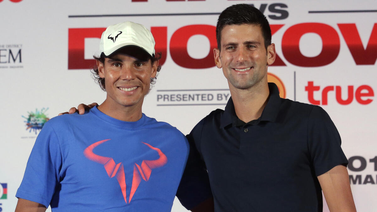 Rafael Nadal (left) and Novak Djokovic after a Press conference for their exhibition match in Bangkok, Thailand. 
