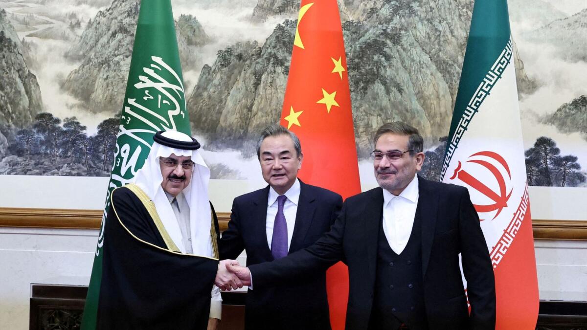 Wang Yi, director of China's Office of the Central Foreign Affairs Commission; Ali Shamkhani, secretary of Iran’s Supreme National Security Council, and Minister of State and national security adviser of Saudi Arabia Musaad bin Mohammed Al Aiban pose for pictures during a meeting in Beijing in March. — Reuters file