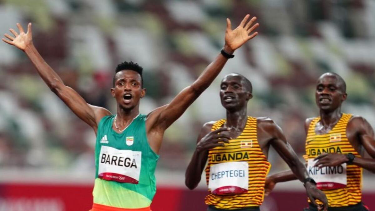 Selemon Barega of Ethiopia celebrates after crossing the finish line. (Reuters)