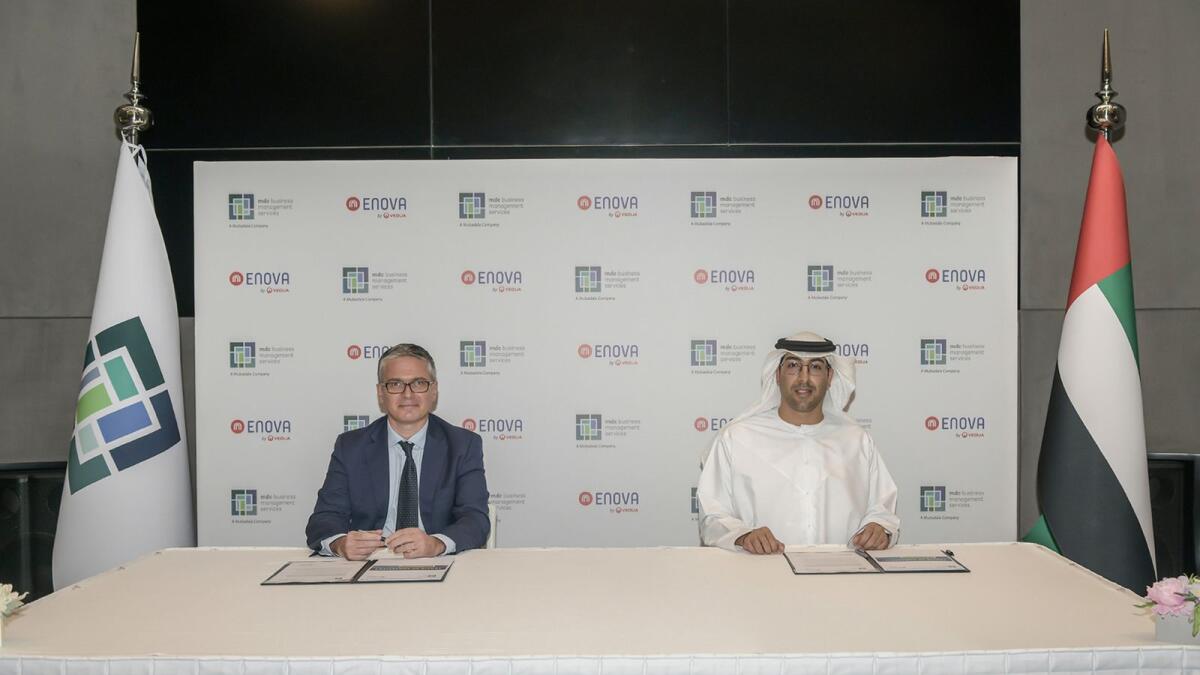Nasir Al Nabhani, CEO of MDC Business Management Services and Renaud Capris, CEO of Enova at the signing ceremony