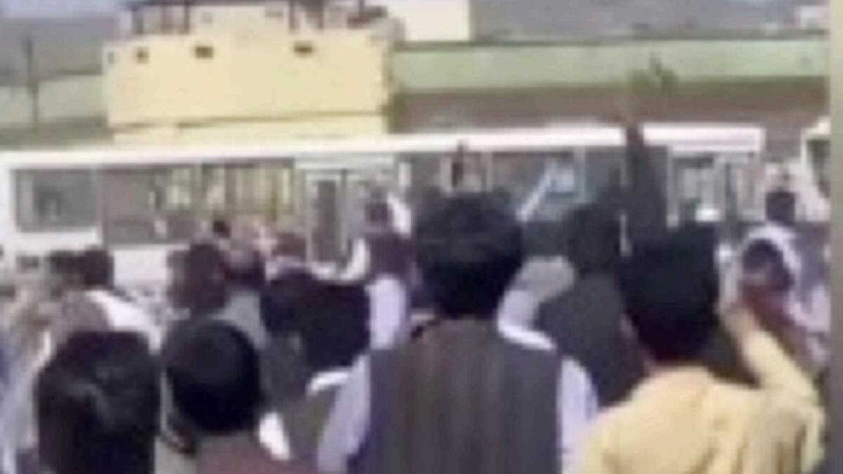 This grab taken from a UGC video shows Iranians hurling stones at a police station in the southeastern city of Zahedan. — AFP