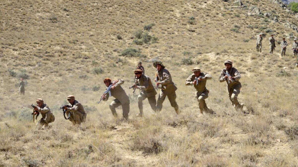 Afghan resistance movement and anti-Taliban uprising forces take part in a military training at Malimah area of Dara district in Panjshir province. — AFP