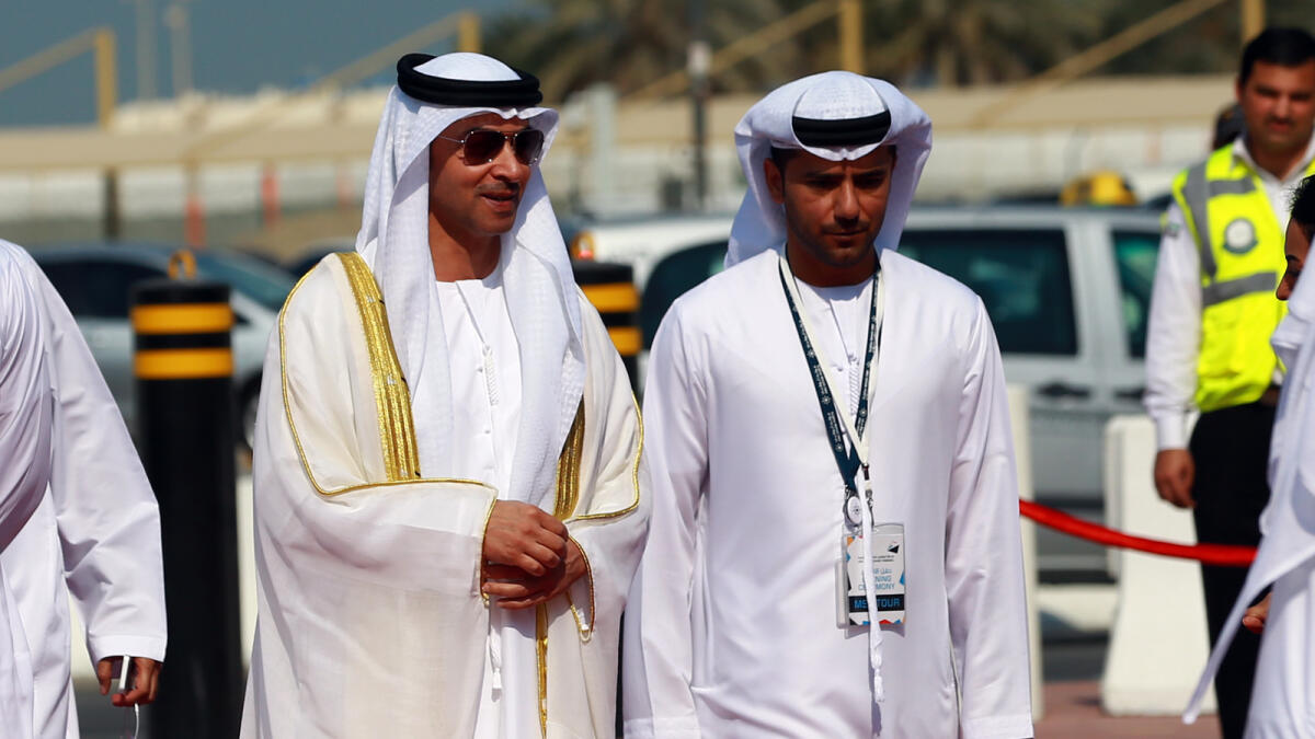Shaikh Hazza bin Zayed Al Nahyan and Captain Mohammed Juma Al Shamisi walk through the cruise terminal at Zayed Port in Abu Dhabi on Sunday.