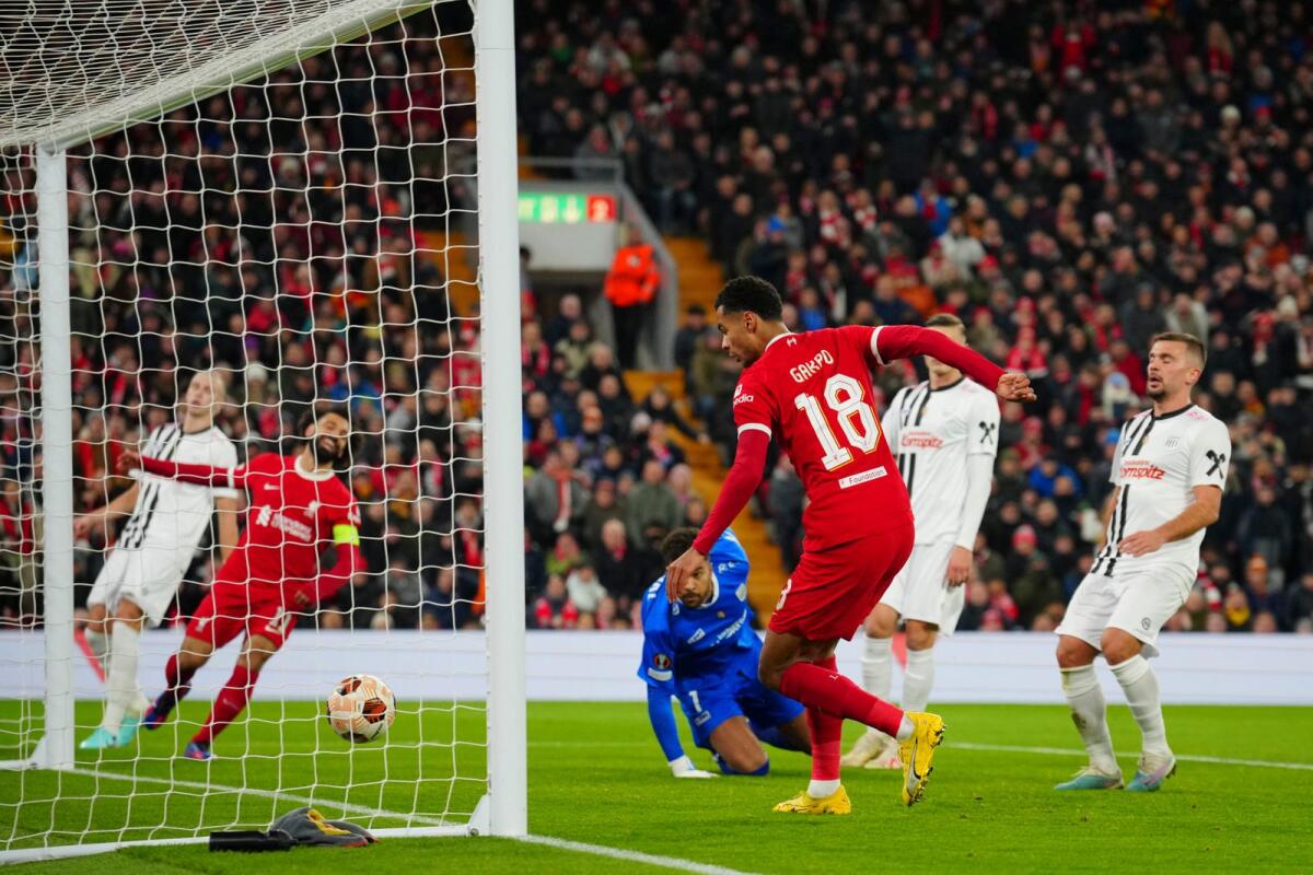 Liverpool's Cody Gakpo scores his side's 2nd goal during the Europa League Group E soccer match between Liverpool and LASK, at the Anfield stadium in Liverpool, England, Thursday. - AP