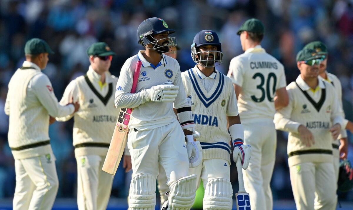 India's KS Bharat (left) and Ajinkya Rahane leave the pitch at the end of the day's play. — AFP