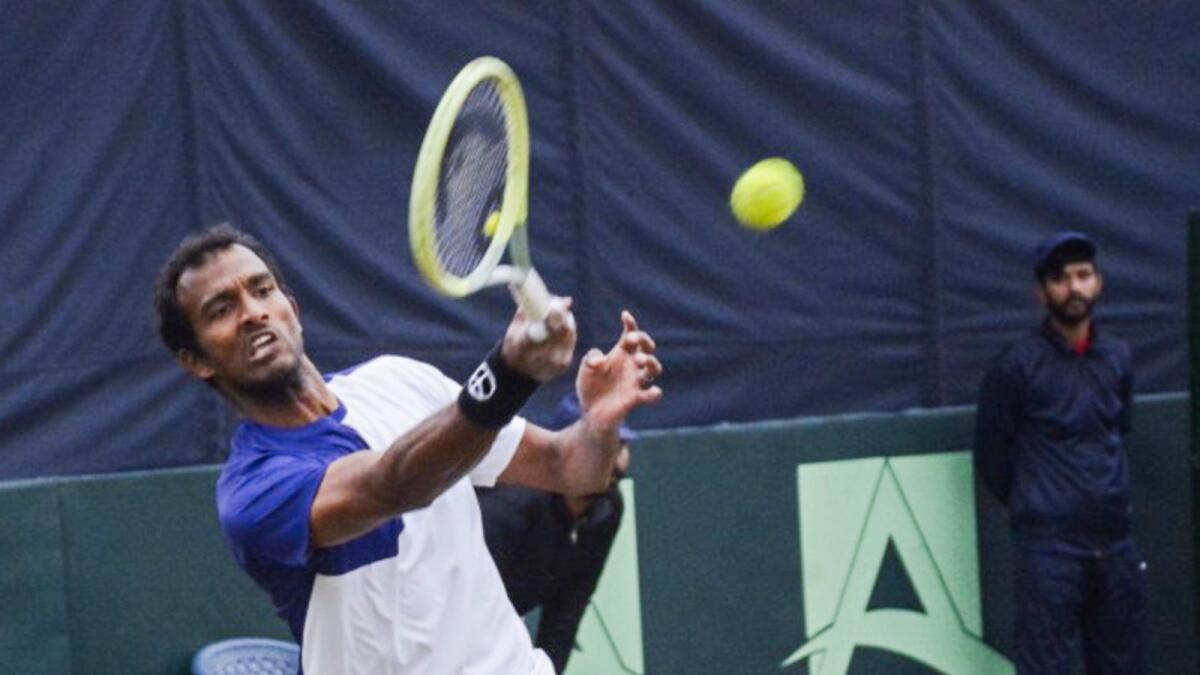 India's Sriram Balaji in action against Pakistan's Aqeel Khan during the opening day of the Davis Cup in Pakistan. - PTI
