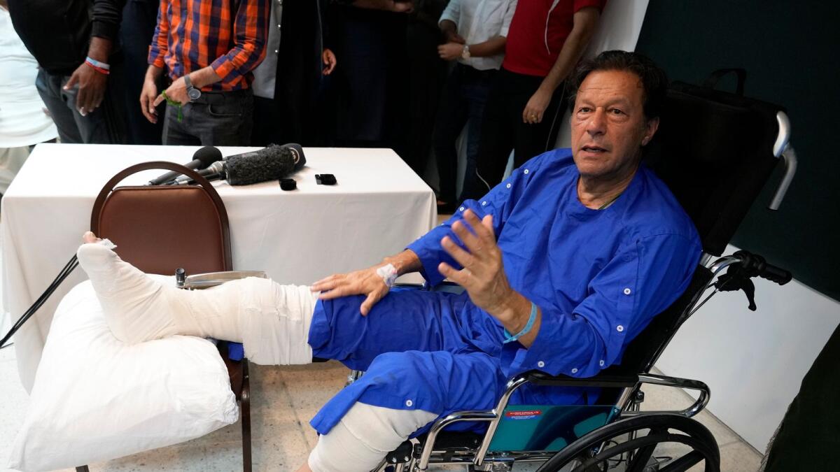 Former Pakistani Prime Minister Imran Khan speaks during a news conference in Shaukat Khanum hospital, where is being treated for a gunshot wound in Lahore on Friday. — AP