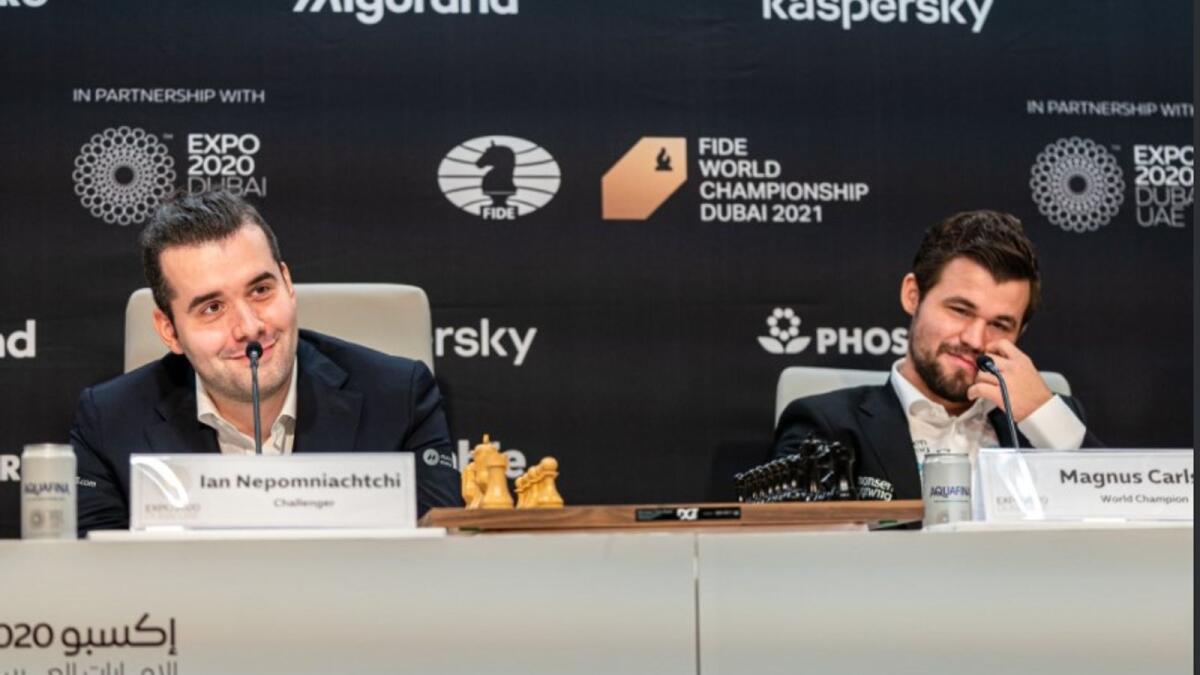 Magnus Carlsen (right) of Norway and Ian Nepomniachtchi of Russia at the press conference in Dubai on Wednesday. (International Chess Federation Twitter)