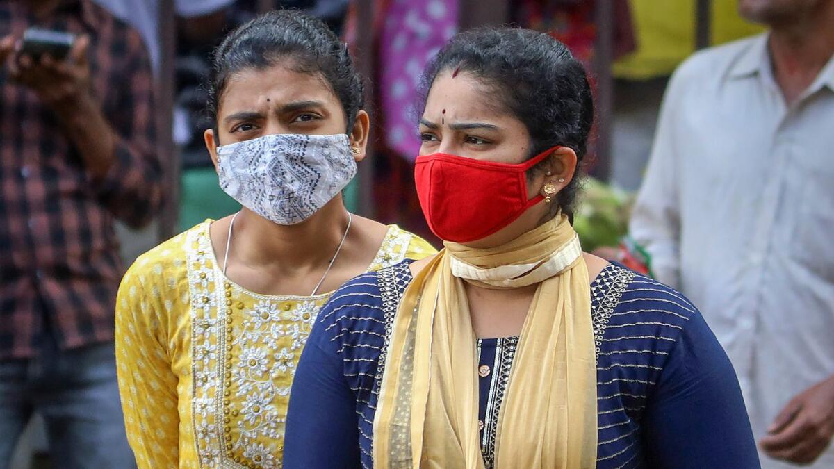 People wearing face masks in the Indian city of Bangalore on December 20 after cases of Covid-19 sub-variant JN.1 were detected in the country. — Photo: PTI