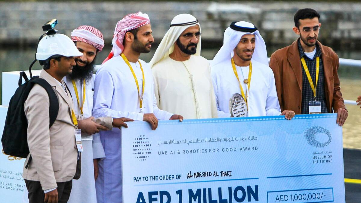 His Highness Shaikh Mohammed bin Rashid Al Maktoum, Vice President and Prime Minister of the UAE and Ruler of Dubai presenting cash prize during the finals of the UAE Drones for Good Awards at Dubai Internet City on Saturday. Photo by Neeraj Murali.