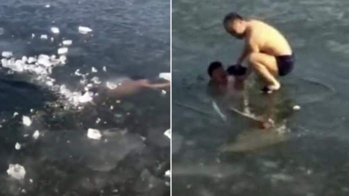 Video: Man swims under frozen water, gets stuck