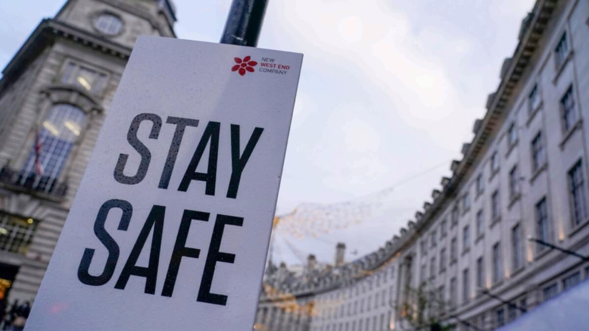 A sign reading 'Stay safe' in Regent Street, in London. — AP file