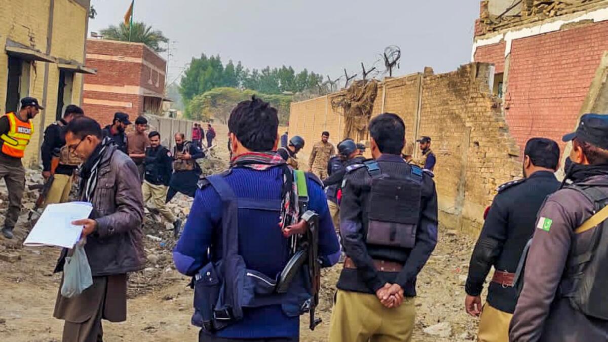 Security personnel at the site after militants rammed an explosive-laden truck into a security forces' post, in Dera Ismail Khan district on December 12. Photo: PTI file