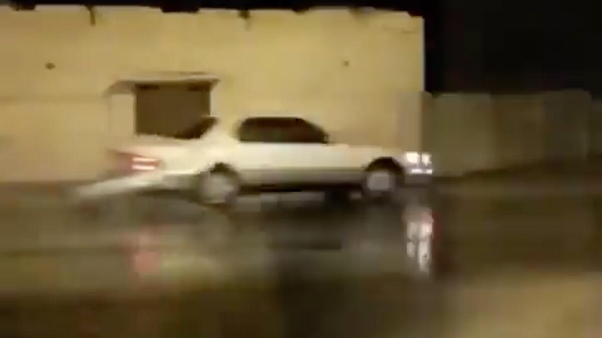 driver, drifting, Oman Police, rain, monsoon