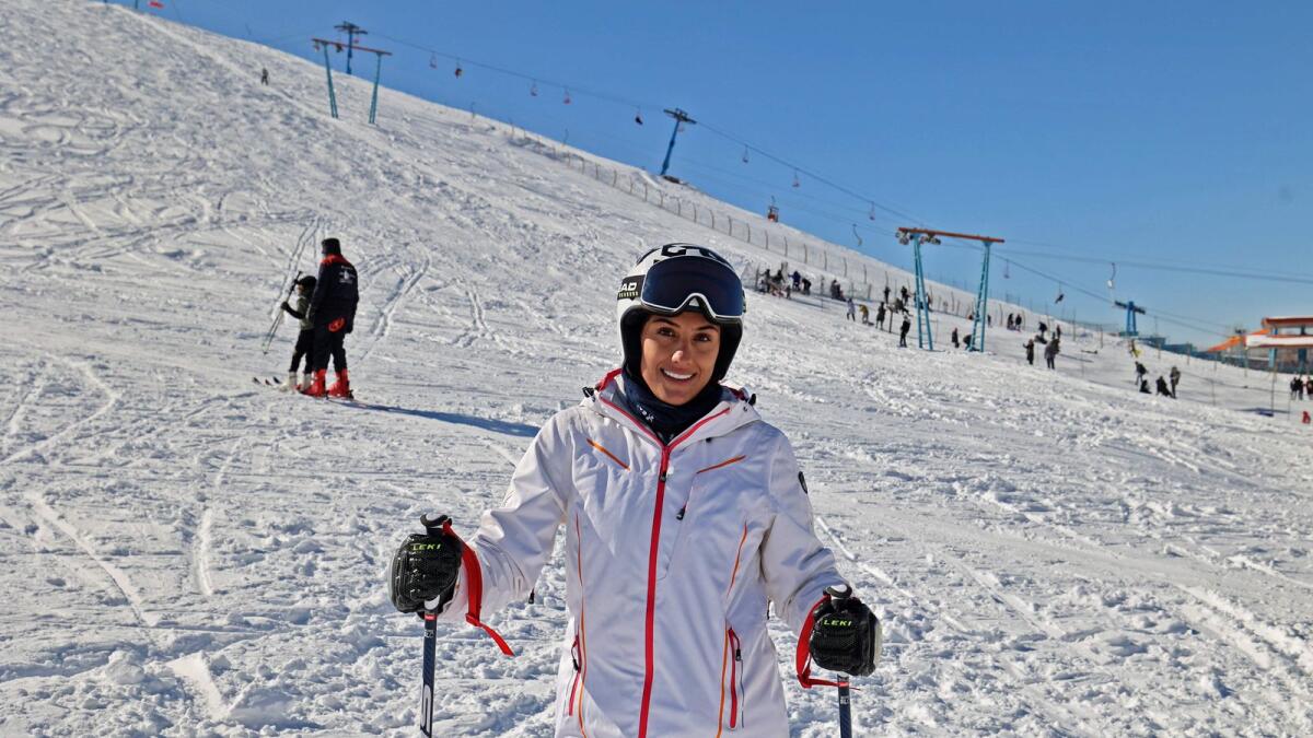 In this file photo taken on January 30, 2022 Iran's Olympic skier Atefeh Ahmadi poses for a picture as she trains for the Winer Olympics, on the slopes of Abali some 45km from the capital Tehran.  — AFP