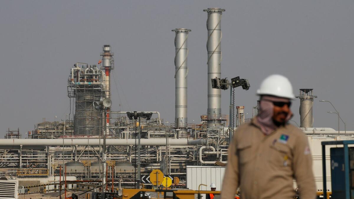 An employee looks on at Saudi Aramco oil facility in Abqaiq, Saudi Arabia. Brent crude futures rose 63 cents, or 1.4 per cent, to $45.59 a barrel by 0733GMT while US West Texas Intermediate crude gained 49 cents, or 1.2 per cent, to $42.91 a barrel. Both benchmarks jumped five per cent last week. — Reuters file