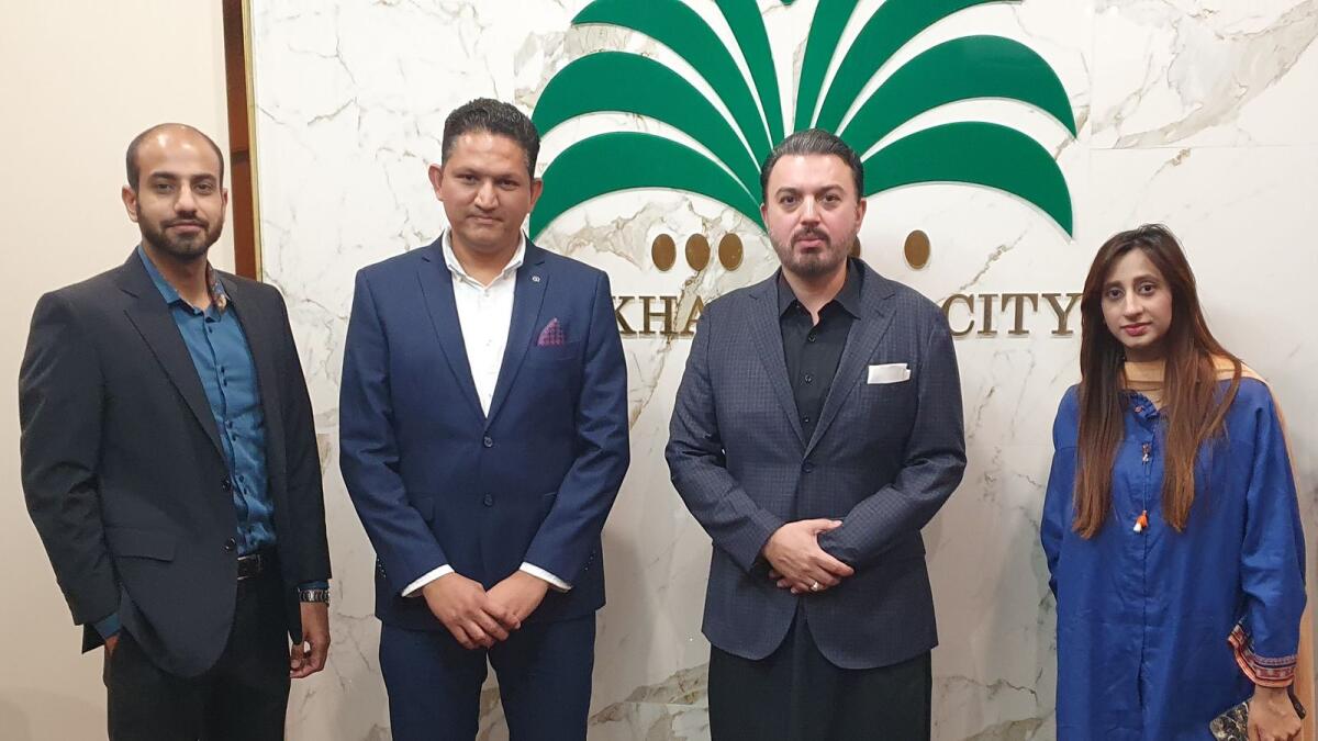 From left to right: Rahat Jarral, Rajab Ali Virani, Jehangir Saifullah Khan and Reema Naseem after signing the MoU recently for 'Crown of Pakistan' real estate project. — Supplied photo