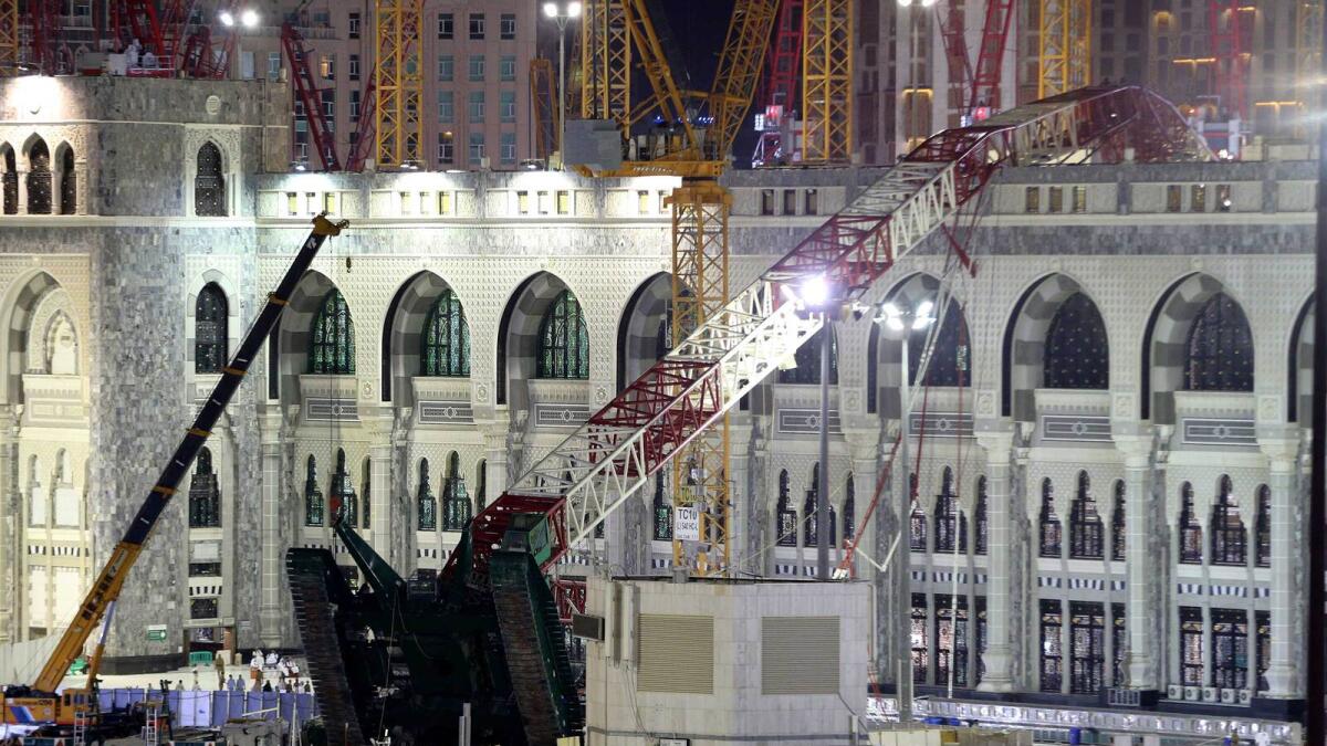 A towering construction crane, center, is seen collapsed over the Grand Mosque.-AP