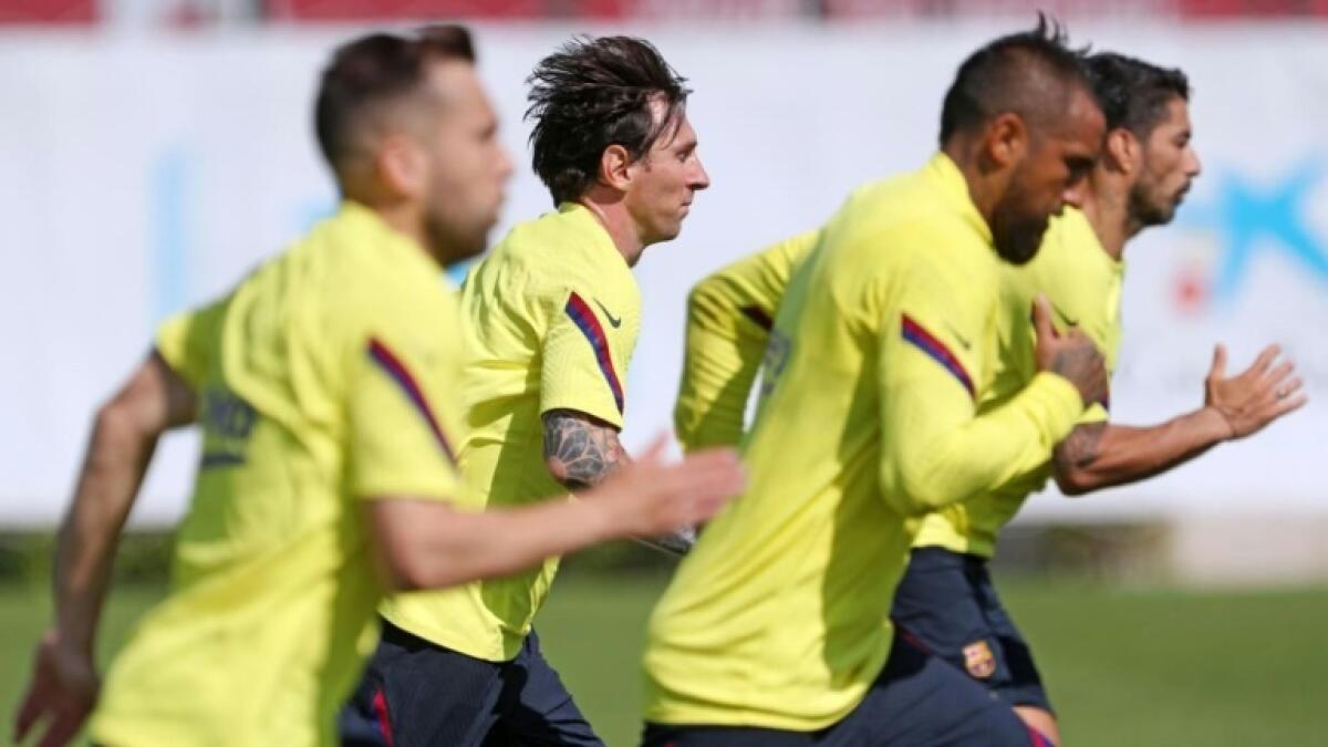 Lionel Messi and his Barcelona teammates are back in training. - AFP file