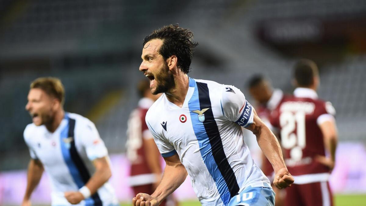 Lazio's Marco Parolo celebrates scoring their second goal. - Reuters