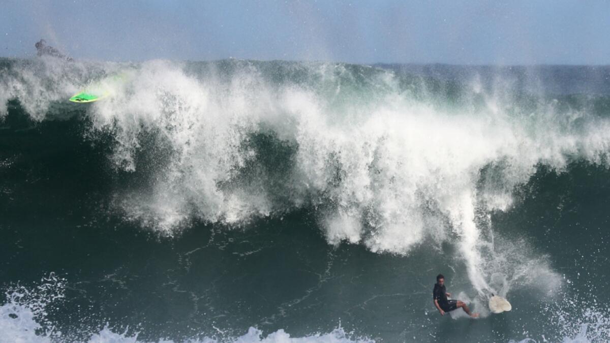 A surfer falls off a wave on a Leblon beach swell in Rio de Janeiro, Brazil. Photo: Reuters