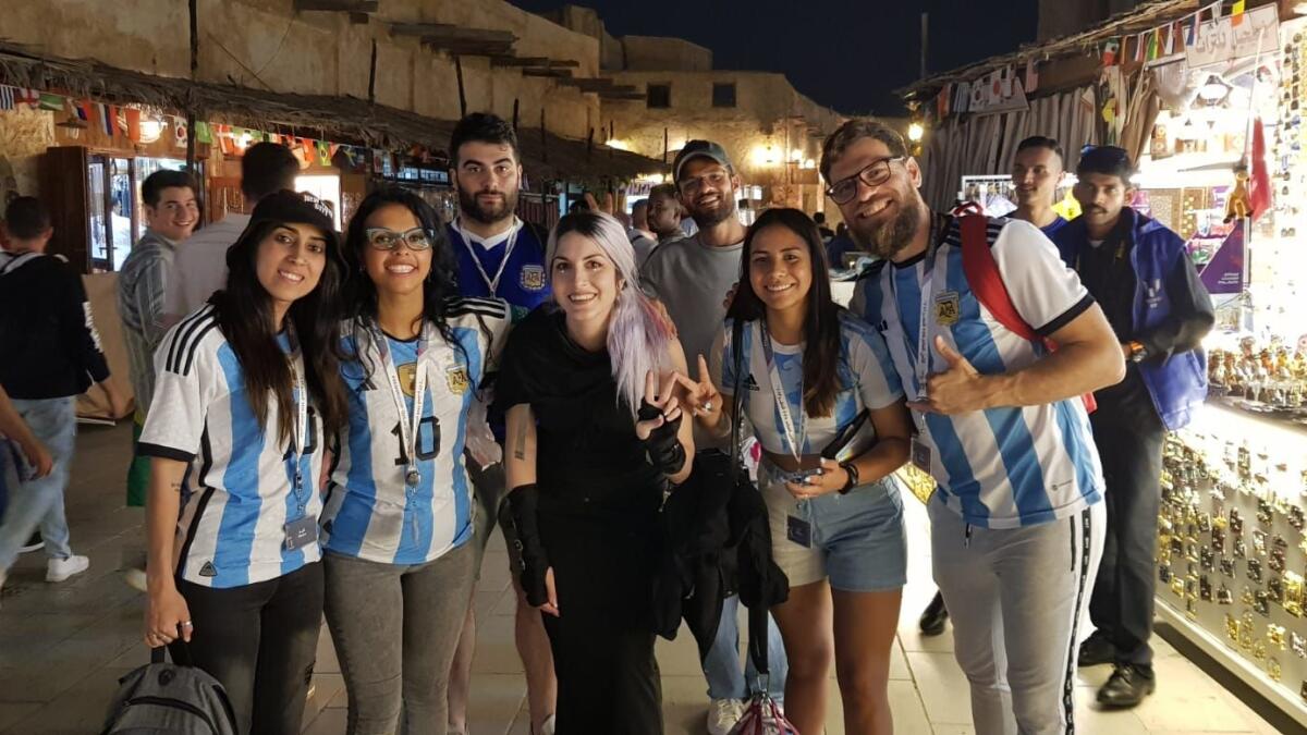 Maga (centre, front row) with other Argentinian fans.