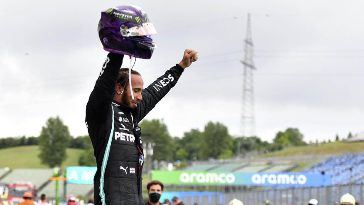 Mercedes driver Lewis Hamilton celebrates after winning the Hungarian Formula One Grand Prix at the Hungaroring racetrack in Mogyorod, Hungary on Sunday. - AP