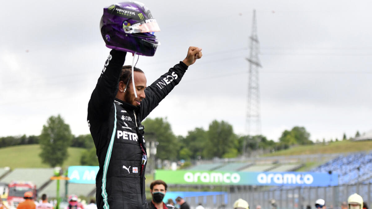 Mercedes driver Lewis Hamilton celebrates after winning the Hungarian Formula One Grand Prix at the Hungaroring racetrack in Mogyorod, Hungary on Sunday. - AP
