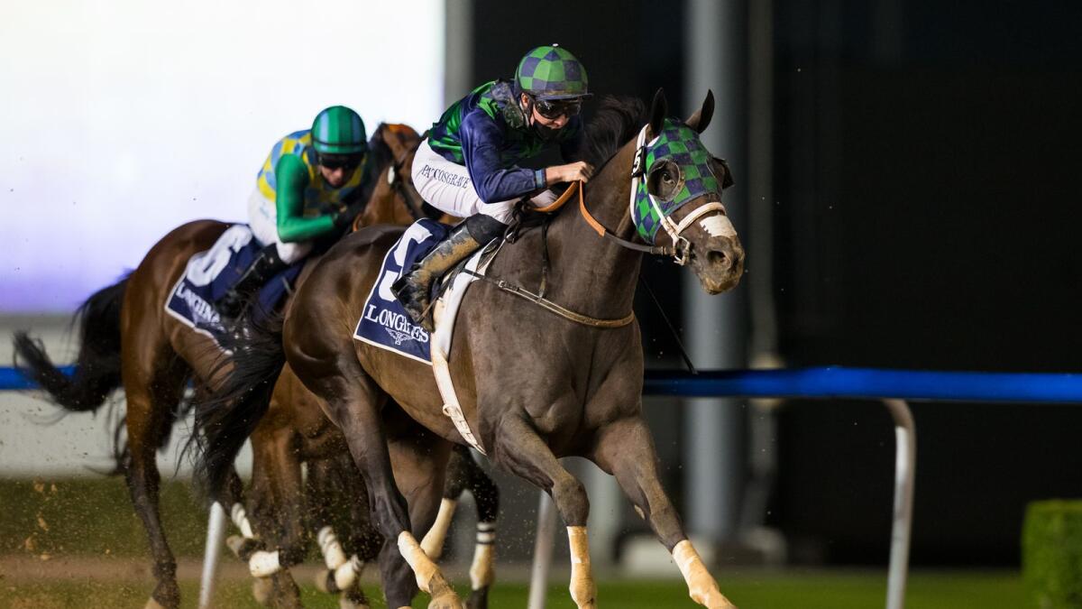 Patrick Cosgrave rides Thegreatcollection to victory in the Dubai Creek Mile at the Meydan Racecourse on Thursday night. — Dubai Racing Club
