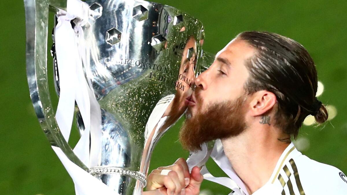 Real Madrid's Sergio Ramos celebrates with the trophy after winning the La Liga last year. (Reuters file)