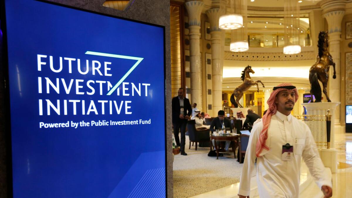 A participant at the Future Investment Initiative walks in the Ritz Carlton Hotel a day before the event in Riyadh. More than 400 US delegates are expected to attend the annual Future Investment Initiative this week. — AP file photo