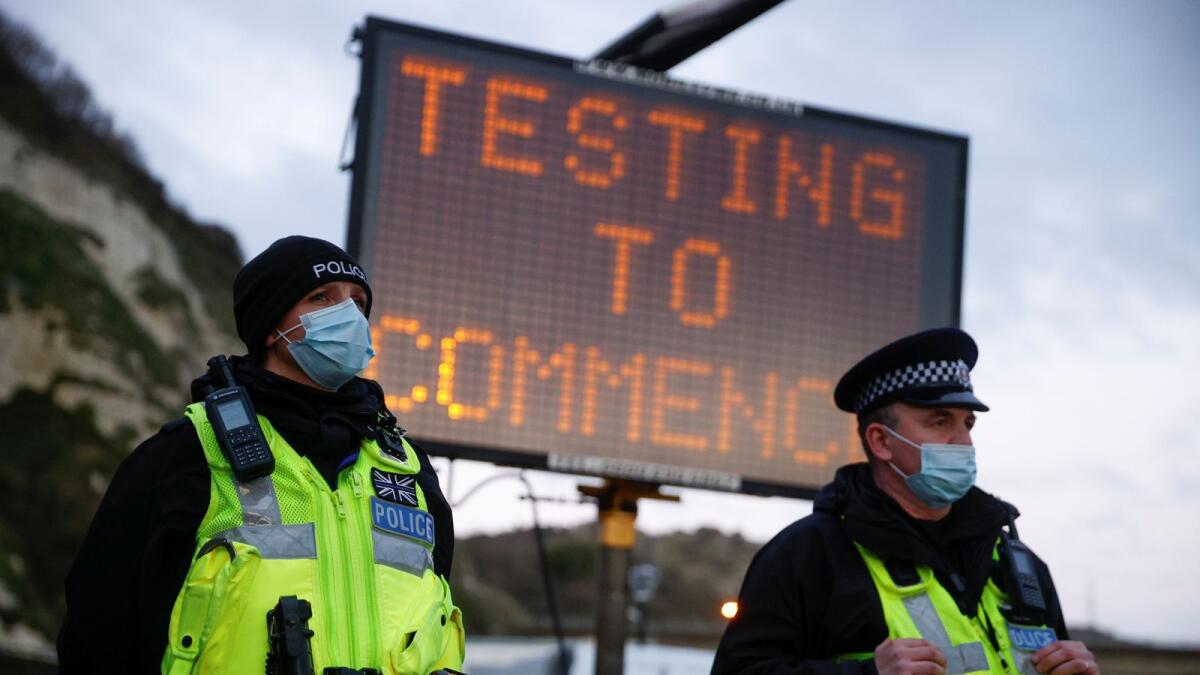 Police officers stand at the entrance to the Port of Dover, amid the coronavirus disease (COVID-19) outbreak, in Dover, Britain December 23, 2020.