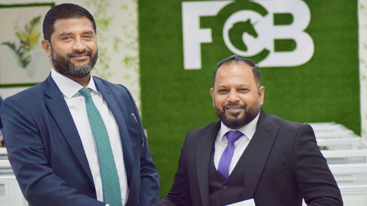 Rusan Fyroze (left) and Faroon Hamim (right) after signing the MoU