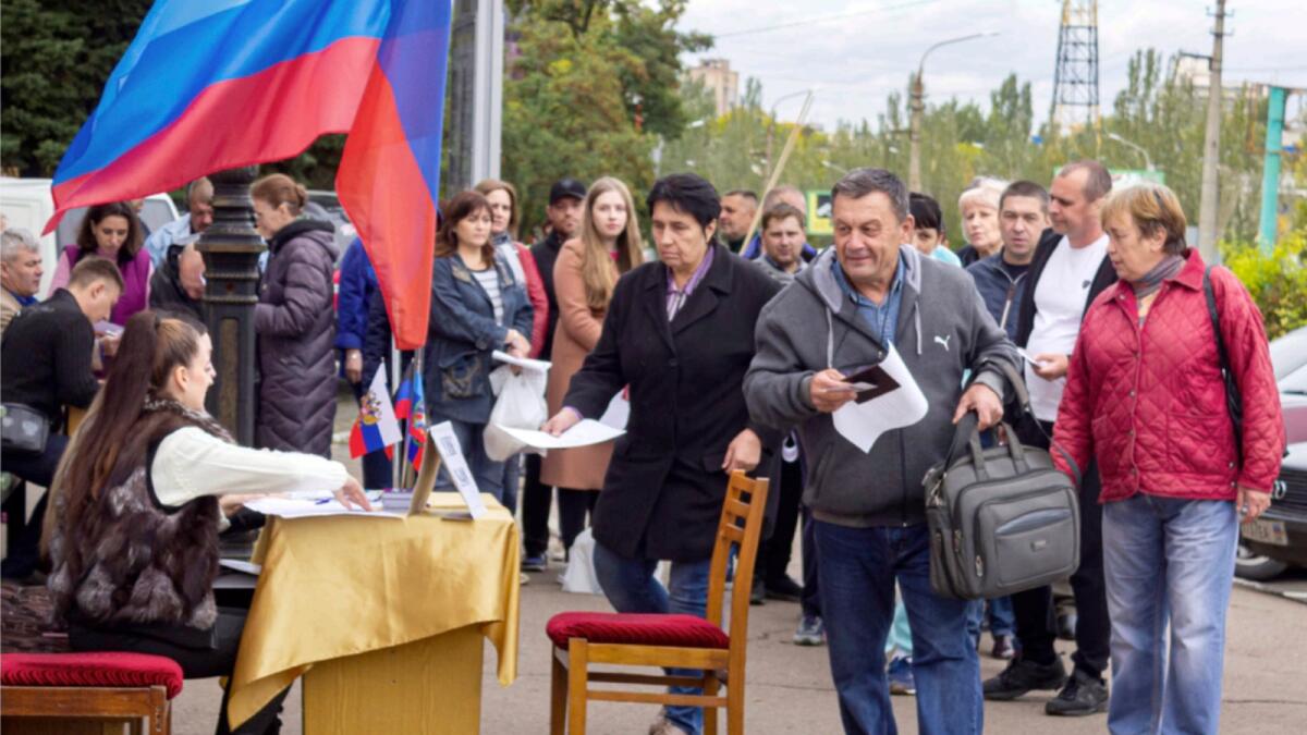 FILE - People line up to vote in a referendum in Lugansk. — AP