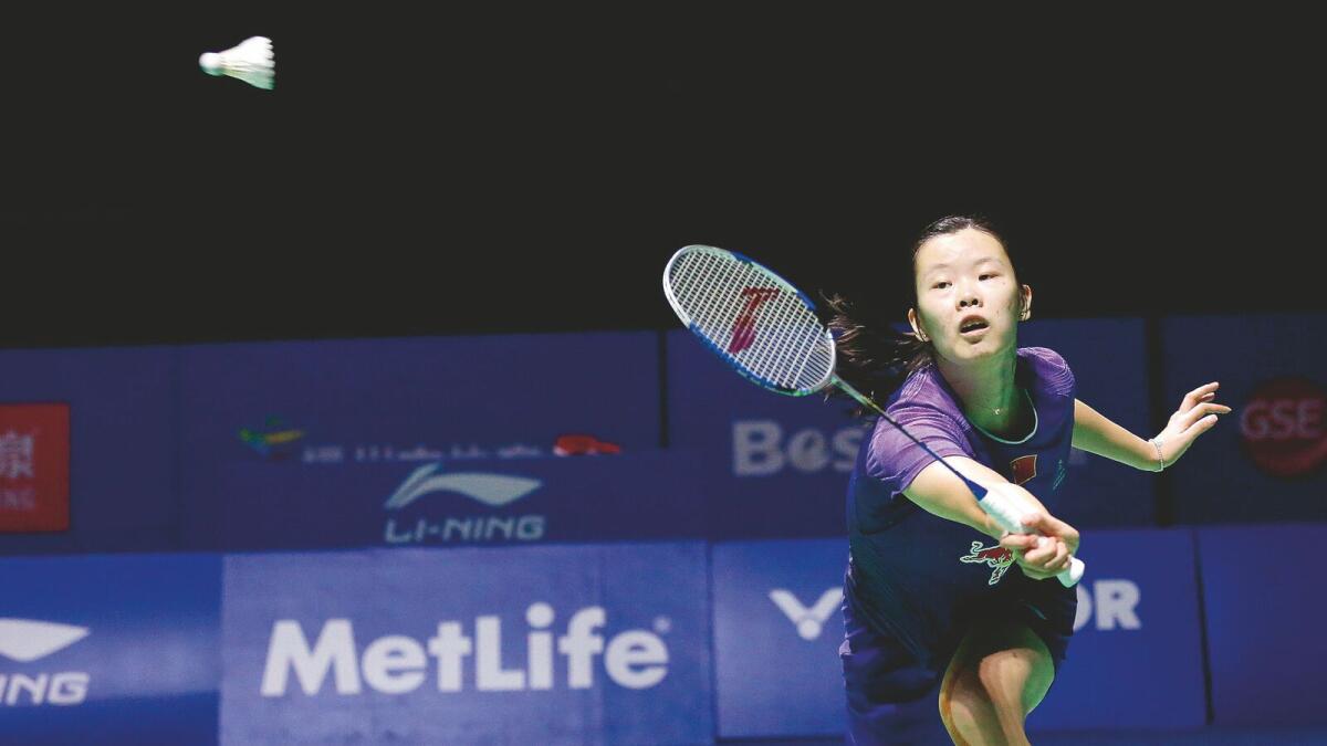 Li Xuerui of China hits a return against Saina Nehwal of India during their women's singles final match at the China Open badminton tournament in Fuzhou, east China's Fujian province on November 15, 2015.           CHINA OUT  AFP PHOTO