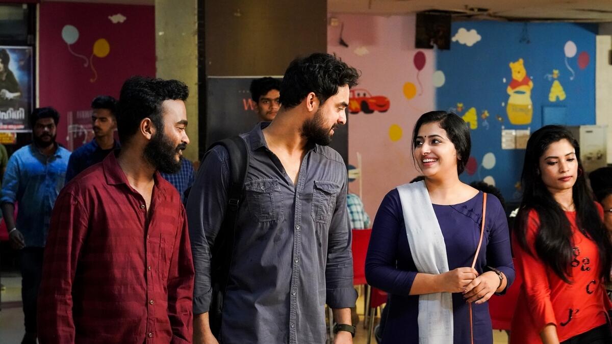 Tovino Thomas with Anu Sithara in a scene from And the Oskar Goes To