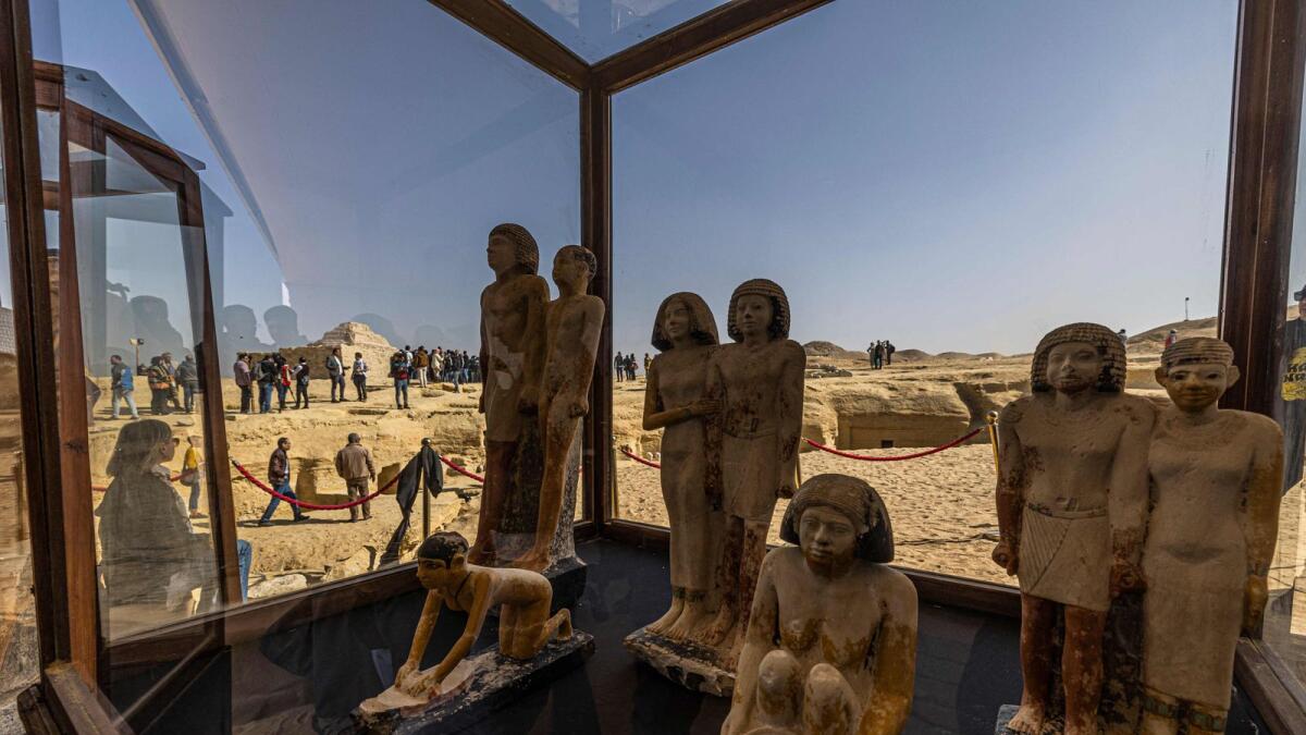 A collection of pharaoh statues is on display during a press conference at the Saqqara necropolis, where a gold-laced mummy and four tombs including of an ancient king's 'secret keeper' were discovered, south of Cairo on Thursday. — AFP