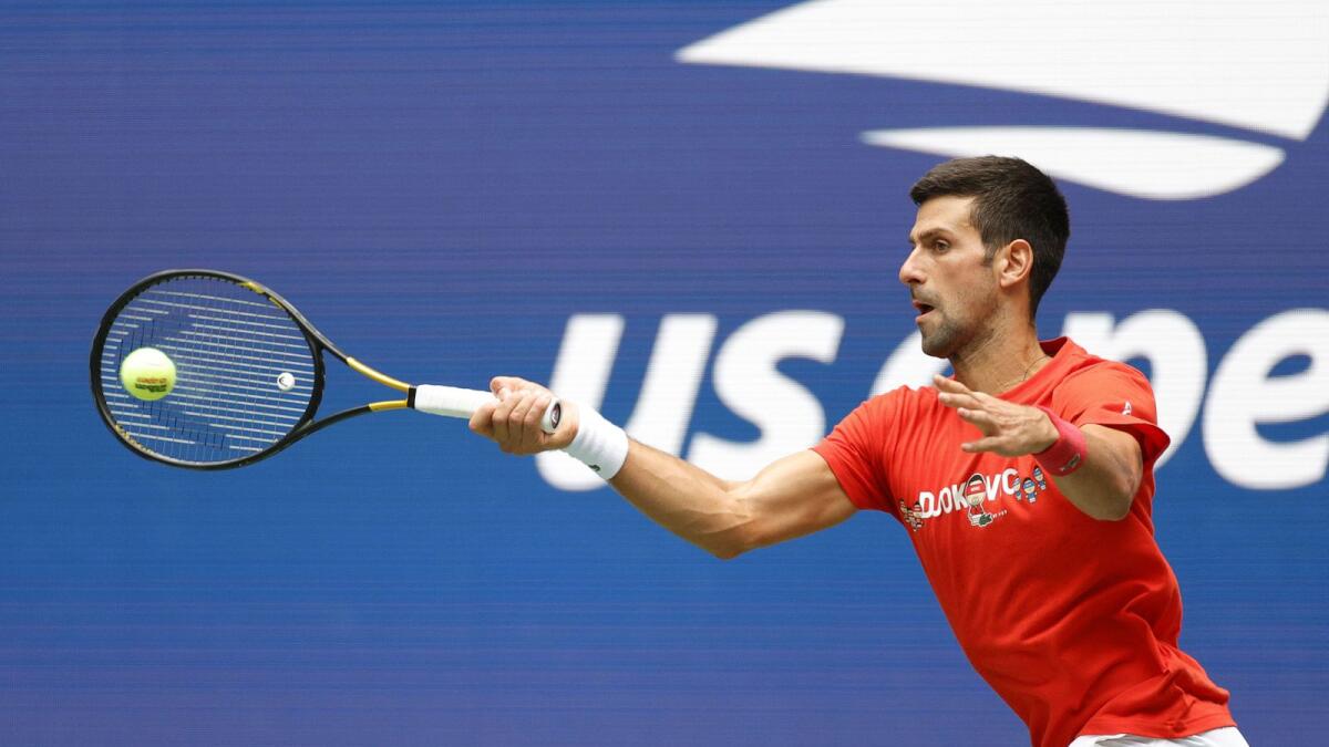 Novak Djokovic of Serbia returns the ball during a practice session prior to the start of the 2021 US Open. — AFP