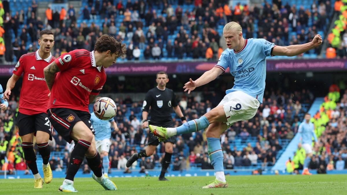 Manchester United's Victor Lindelof blocks a shot from Manchester City's Erling Haaland. (Reuters)
