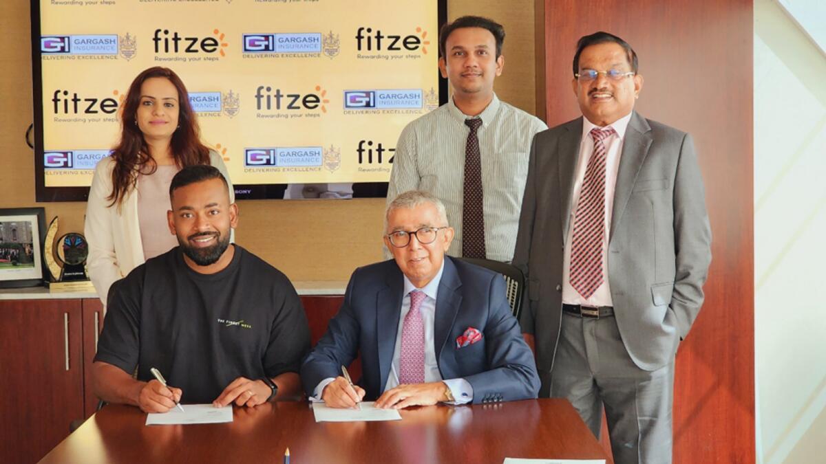 Mr Mustafa Vazayil, Managing Director – Gargash Insurance, and Mr. Ben Samuel, CEO – Fit on Click, signing the agreement. Photo: Supplied