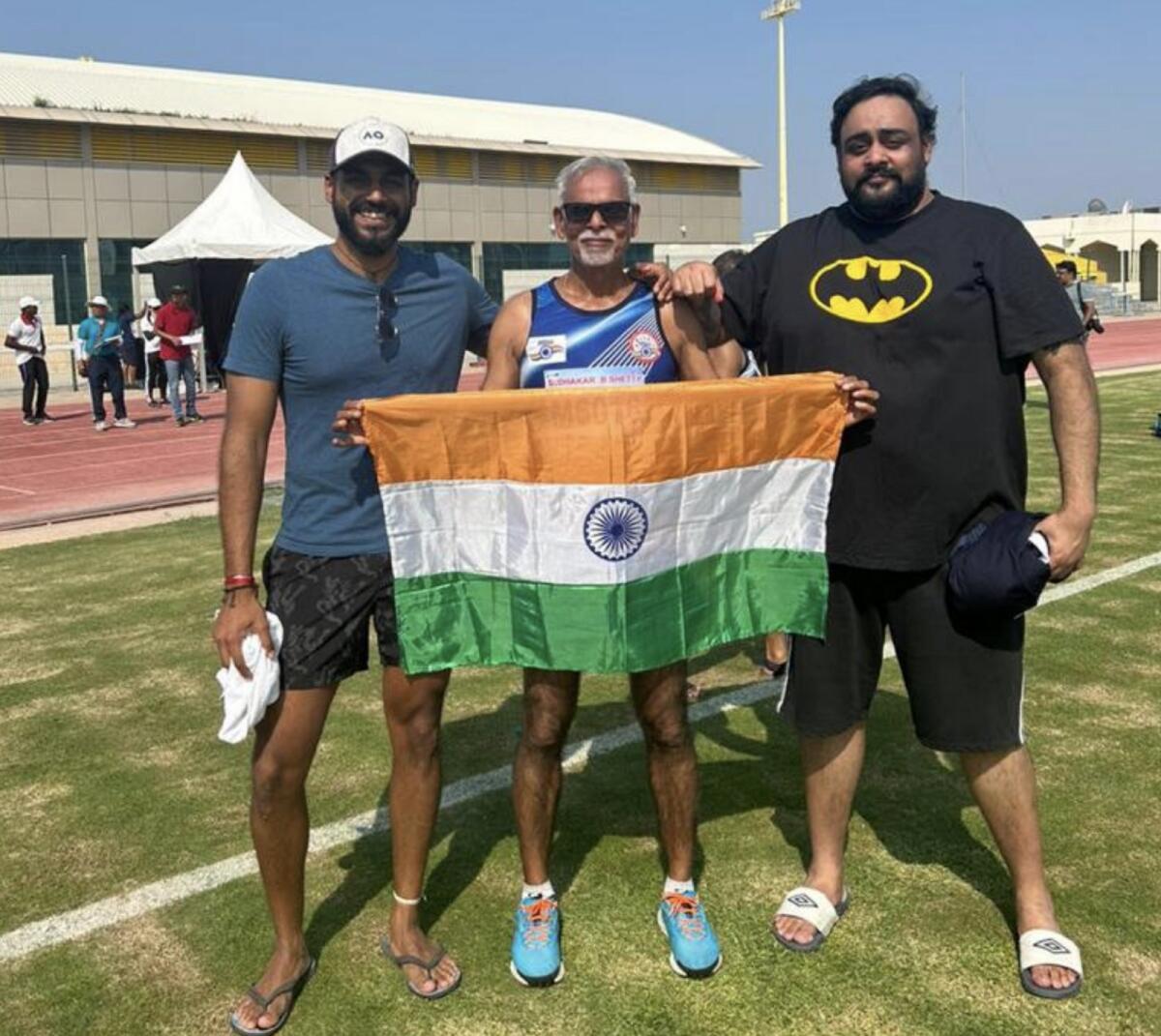 Sudhakar Shetty (centre) celebrates after winning the gold medal. — Supplied photo