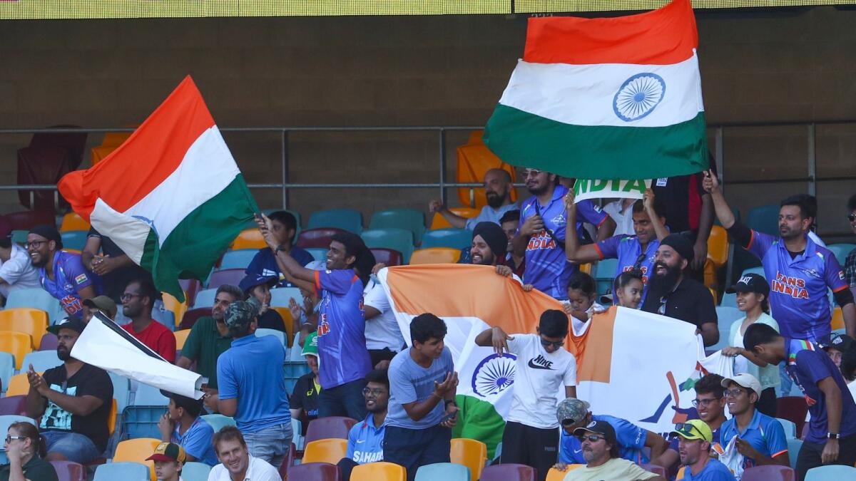 Indian fans cheer their team during play on the final day of the fourth cricket Test between India and Australia at the Gabba. — AP