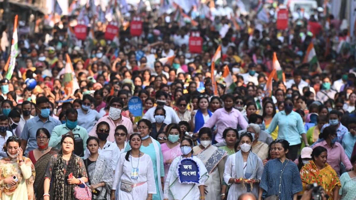 West Bengal Chief Minister Mamata Banerjee leads an election procession in Kolkata.