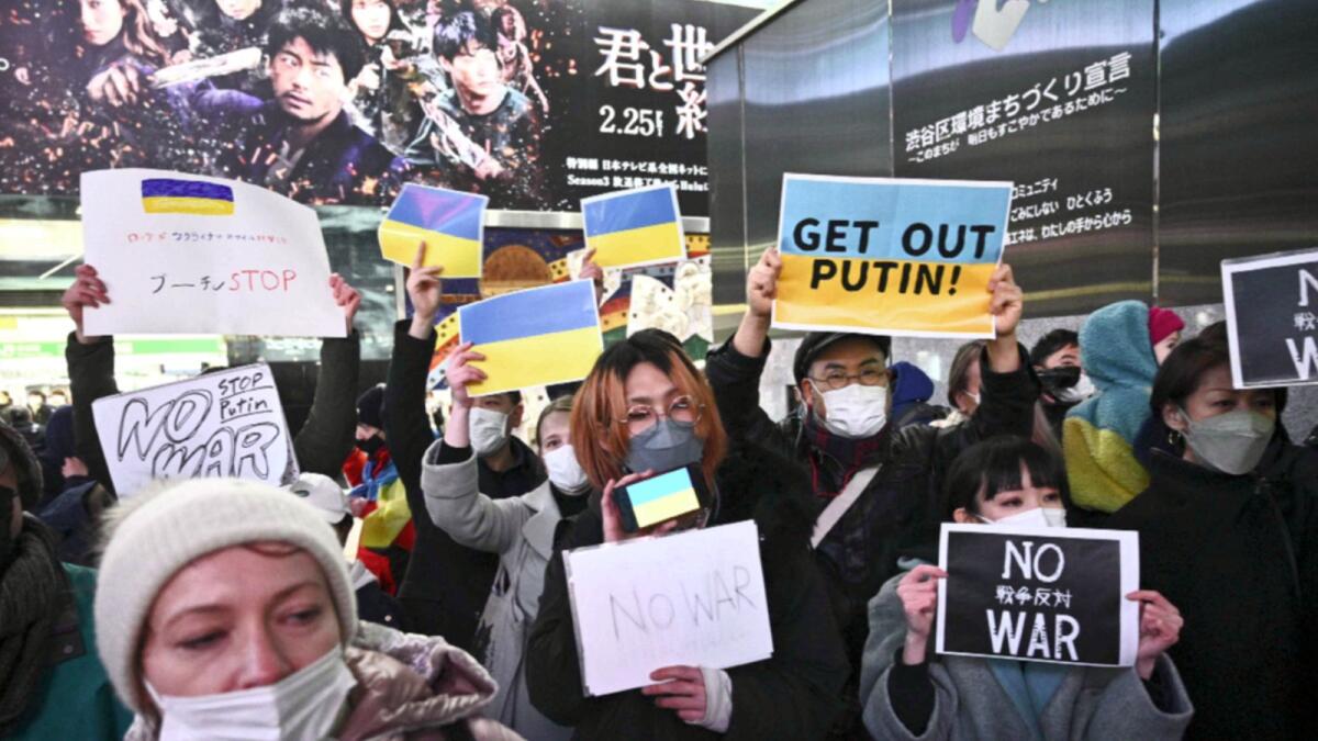 People protest against Russia's actions in Ukraine during a rally at Shibuya district in Tokyo. — AFP