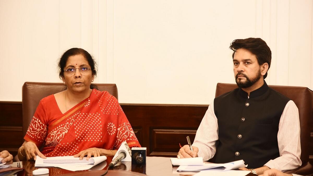 TWEAKING BUDGET: Indian Finance Minister Nirmala Sitharaman and  Minister of State for Finance Anurag Singh Thakur address the media via video conferencing in New Delhi on Tuesday. - PTI