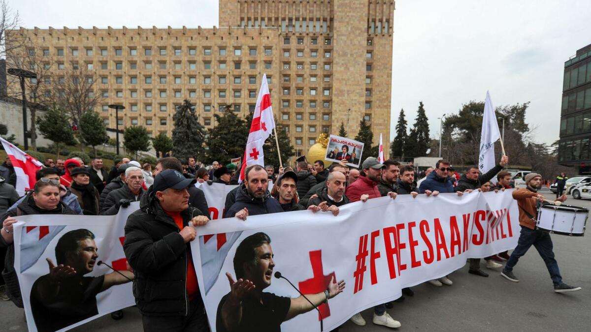 People join a rally in support of Mikheil Saakashvili near the government building in Tbilisi, Georgia. — Reuters