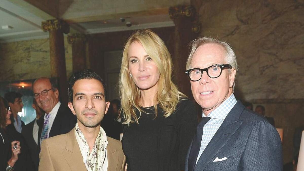Amed with American designer Tommy Hilfiger and his wife Dee Ocleppo