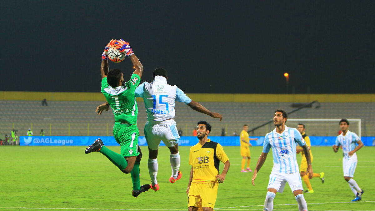 Al Wasl goalkeeper Rashed Ali thwarts Bani Yas’ Ahmed Khameis Rabei from scoring at Zabeel Stadium in Dubai on Friday. 