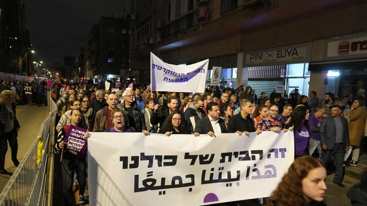 Protesters march in Tel Aviv against Prime Minister Benjamin Netanyahu's far-right government. — AP